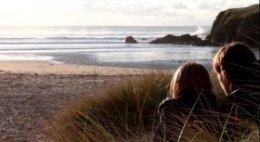 Couple sat in Sanddunes near Bedruthan Hotel