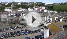clip 456771: Cars parked at low tide in Port Isaac harbour